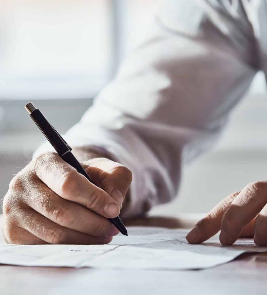 client is signing papers with criminal lawyer